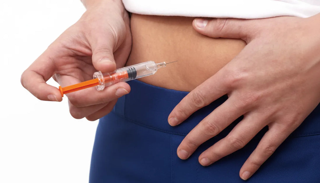 Close-up of a person preparing a tirzepatide injection in the abdomen, illustrating proper technique after a missed dose.